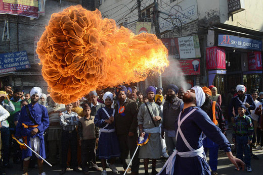 Sikh Nihang (warrior) performs a fire breathing Energy-based alien life